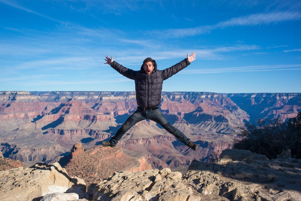 "Caucasian man jumping at Grand Canyon, Arizona, United States"